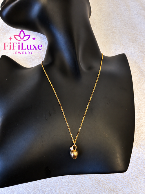 variant: Gold | Apple Belle Necklace, gold pendant styled on black display